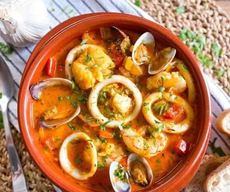 Traditional Spanish Seafood Soup with Fresh Herbs