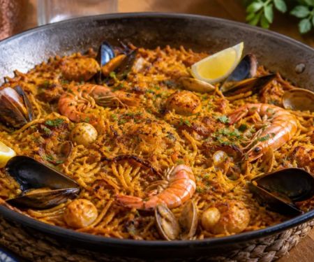 Fideuà at a Spanish Restaurant: Noodles, Seafood, Socarrat, and Timing