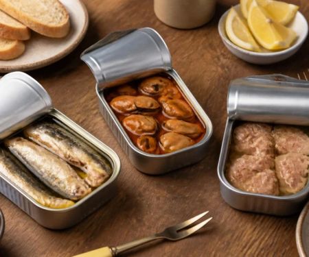 Spanish Conservas at a Restaurant: Seafood, Packing Liquid, and Sharing